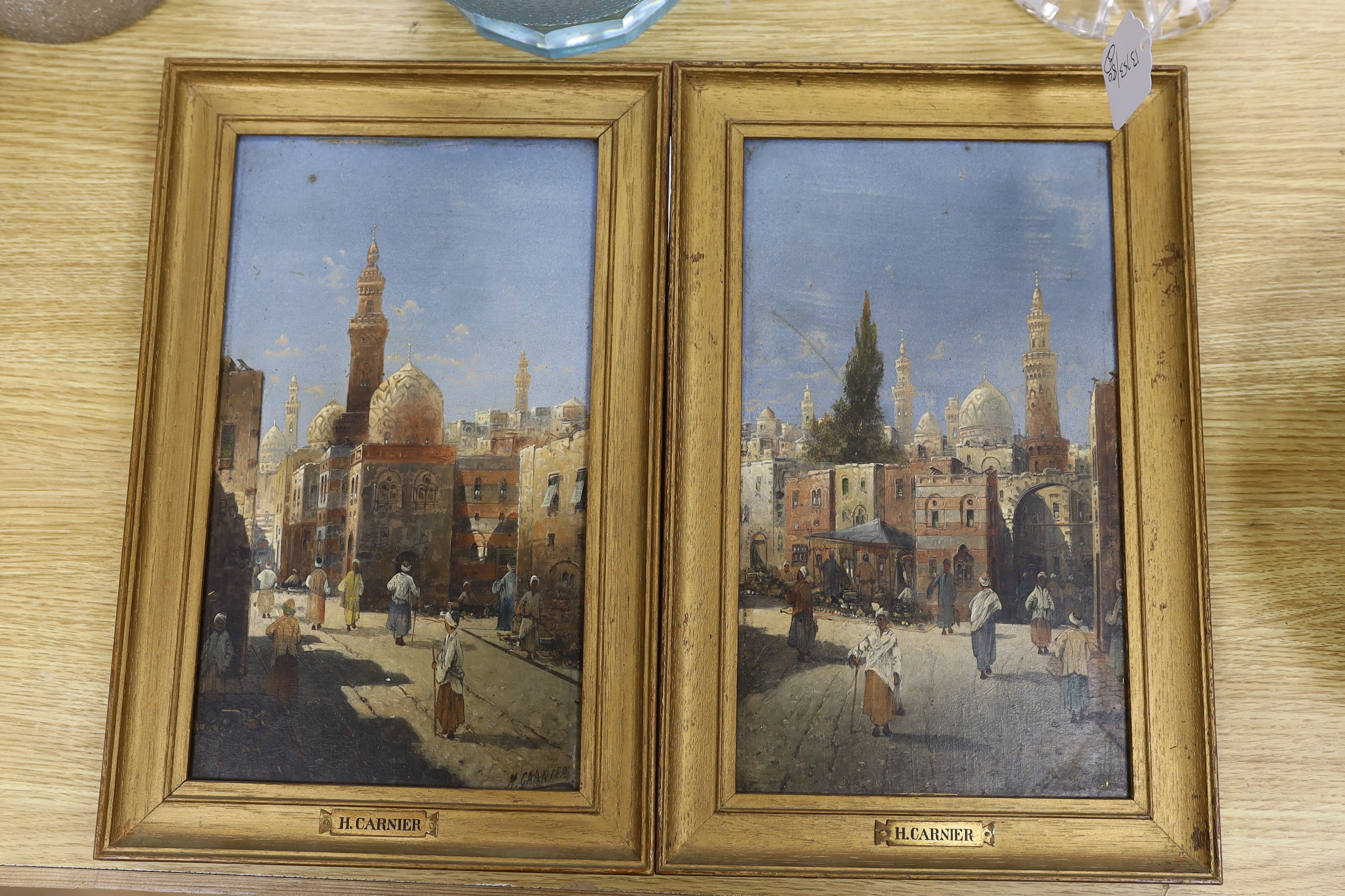 Karl Kaufmann (Austrian, 1843-1905), pair of Orientalist oils on board, Eastern street scenes with figures, each signed, H. Carnier, 30 x 17cm